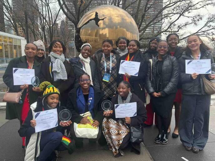 A group of people posing for a photoAI-generated content may be incorrect.