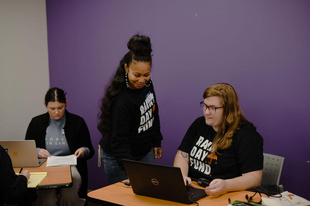 RDF staff and volunteers work at a driver's license clinic.